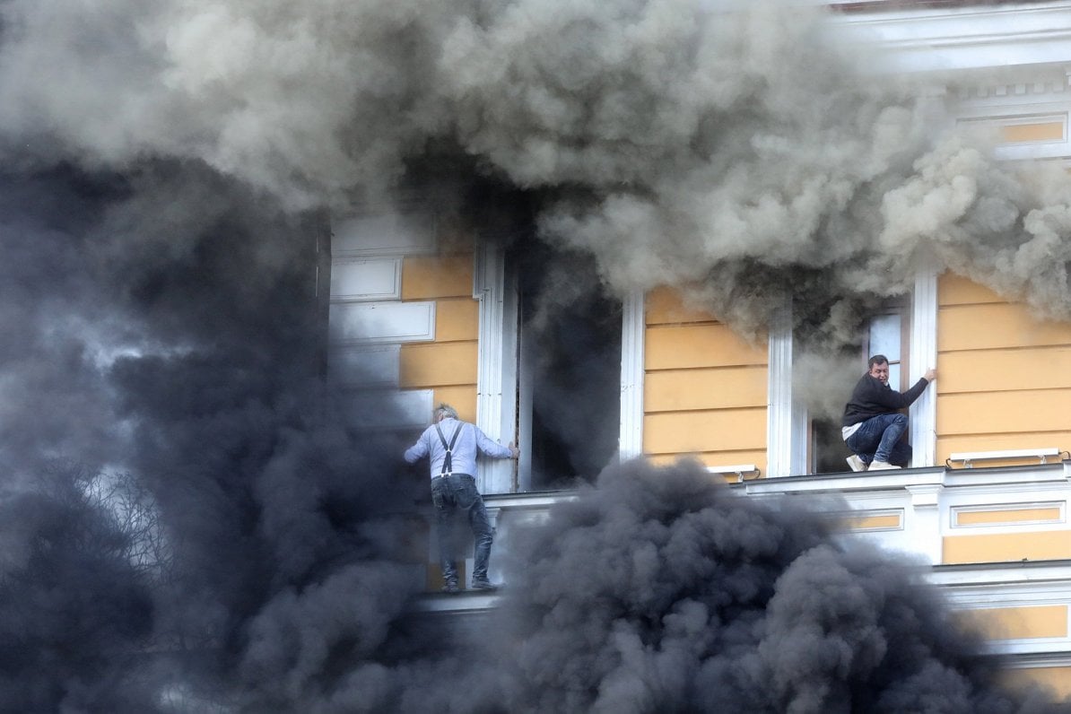 Smoke pouring from the damaged Presidium building in Kyiv
